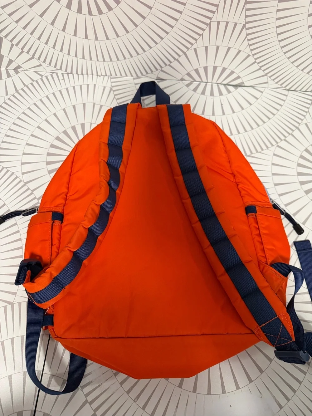 STATE Bags Kane kids backpack in an orange chevron puffer style